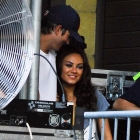  Ashton Kutcher and Mila Kunis laugh as they watch Robin Thicke from backstage in Chicago