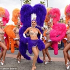  Maria Menounos turns Vegas Showgirl in a Jeweled bra and Feathered Head dress