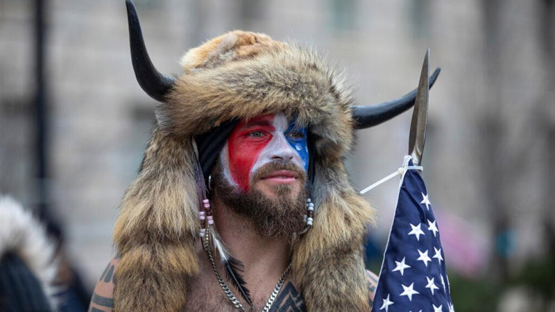  QAnon Shaman Wins Legal Battle as Judge Orders Return of Iconic Horns and Spear